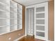Bedroom featuring a large built-in shelving unit and a closet at 536 Detroit St, Denver, CO 80206