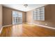 Bedroom features hardwood floors, white shelving and a sliding glass door at 536 Detroit St, Denver, CO 80206