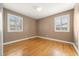 Bright bedroom features hardwood floors and white shuttered windows at 536 Detroit St, Denver, CO 80206