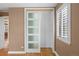 Bedroom displaying closet with sliding doors and white shuttered window at 536 Detroit St, Denver, CO 80206