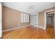 Bedroom showcasing hardwood floors, built-in shelving and sliding glass closet at 536 Detroit St, Denver, CO 80206