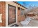 Charming brick home with a glass front door, showcasing its welcoming facade and curb appeal at 536 Detroit St, Denver, CO 80206