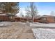 Charming brick home featuring a walkway and a well-maintained lawn with minimal winter snow cover at 536 Detroit St, Denver, CO 80206