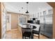 Contemporary kitchen with a central island, pendant lights, stainless steel appliances, and ample cabinetry at 536 Detroit St, Denver, CO 80206