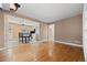 Open concept living room that flows into the kitchen, complete with hardwood floors and neutral paint at 536 Detroit St, Denver, CO 80206