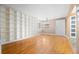 Inviting living room featuring hardwood floors, built-in bookshelves and great natural light at 536 Detroit St, Denver, CO 80206