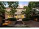 Well-manicured backyard with beautiful landscaping and a patio area at 165 N High St, Denver, CO 80218