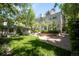 Beautiful backyard featuring landscaping, greenery, patio, and guest house at 165 N High St, Denver, CO 80218