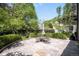 Outdoor dining area set on a stone patio surrounded by lush landscaping at 165 N High St, Denver, CO 80218