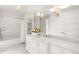 Elegant bathroom with marble countertops, ample cabinet space, and tub-shower combo at 165 N High St, Denver, CO 80218