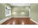 Expansive bedroom features hardwood floors, decorative sconces, and an abundance of natural light at 165 N High St, Denver, CO 80218