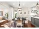 Cozy dining area with decorative chandelier, zebra rug, and access to additional living spaces at 165 N High St, Denver, CO 80218
