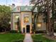 Elegant home boasts a classic design with a beautiful yard and distinctive architectural details at 165 N High St, Denver, CO 80218