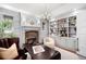 Office with fireplace, hardwood floors, and decorative shelving at 165 N High St, Denver, CO 80218