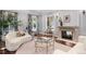 Stylish living room featuring a fireplace, decorative trim, and abundant natural light from large windows at 165 N High St, Denver, CO 80218