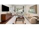Comfortable living room featuring built-in shelving, a window seat, and a serene atmosphere at 165 N High St, Denver, CO 80218