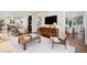 Open-concept living area with stylish furnishings, hardwood floors, and seamless transitions to other spaces at 165 N High St, Denver, CO 80218