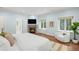 Light-filled main bedroom with a fireplace and large windows at 165 N High St, Denver, CO 80218