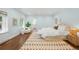 Bright, spacious main bedroom with hardwood floors and natural light at 165 N High St, Denver, CO 80218