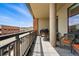 Spacious balcony with a view of the city, comfortable seating, and a grill for outdoor cooking at 20 Wilcox St # 208, Castle Rock, CO 80104