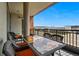 Enjoy city views from this spacious balcony with outdoor dining set, perfect for relaxing or entertaining at 20 Wilcox St # 208, Castle Rock, CO 80104