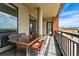 Large balcony with dining table and chairs, offering stunning city views and a great outdoor space at 20 Wilcox St # 208, Castle Rock, CO 80104