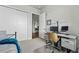 Bedroom space has a balcony and desk area, connected to an open kitchen concept through doorways at 20 Wilcox St # 208, Castle Rock, CO 80104