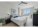 Bright bedroom with a large window, stylish decor, and comfortable seating area at 20 Wilcox St # 208, Castle Rock, CO 80104