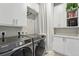 Well-organized laundry room with modern Samsung washer and dryer and ample storage space at 20 Wilcox St # 208, Castle Rock, CO 80104