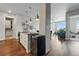 Open layout kitchen with island seating, a stylish dining space, and a comfortable living area at 20 Wilcox St # 208, Castle Rock, CO 80104