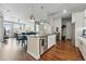 Open concept living space with kitchen island, dining area, and a comfortable living area at 20 Wilcox St # 208, Castle Rock, CO 80104