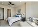 This main bedroom is brightly lit with a walk in closet, an attached bathroom, and light colored walls at 20 Wilcox St # 208, Castle Rock, CO 80104