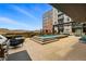 Outdoor pool and grill area with patio furniture and mountain views at 20 Wilcox St # 208, Castle Rock, CO 80104
