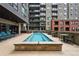 Charming community pool and grilling area featuring lounge chairs and outdoor seating at 20 Wilcox St # 208, Castle Rock, CO 80104