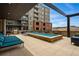 Charming community pool and grilling area featuring lounge chairs and outdoor seating at 20 Wilcox St # 208, Castle Rock, CO 80104