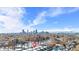 Aerial view showing home's location with city skyline & mountain views at 1725 E Martin Luther King Jr Blvd, Denver, CO 80205