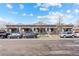 Four-unit building with Spanish-style architecture and gray exterior at 1725 E Martin Luther King Jr Blvd, Denver, CO 80205