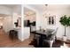 Inviting dining area open to the modern kitchen, featuring stylish lighting and seamless flow for entertaining and everyday living at 8422 Everett Way # D, Arvada, CO 80005