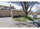 Exterior view of home with garage, yard, and a convenient mailbox area at 8422 Everett Way # D, Arvada, CO 80005