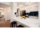 Modern kitchen featuring white cabinets, stainless steel appliances, and a spacious countertop, perfect for culinary creations at 8422 Everett Way # D, Arvada, CO 80005
