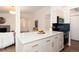 Open concept kitchen features a white countertop island and stainless steel appliances at 8422 Everett Way # D, Arvada, CO 80005