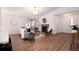 Spacious living room features a fireplace, modern decor, and sliding glass door with seamless transition to outdoor spaces at 8422 Everett Way # D, Arvada, CO 80005