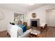 Cozy living room with a stylish fireplace, comfortable seating, and plenty of natural light creating an inviting atmosphere at 8422 Everett Way # D, Arvada, CO 80005