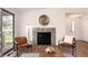 Inviting living area featuring a modern fireplace, sleek seating, and large windows enhancing the bright, open space at 8422 Everett Way # D, Arvada, CO 80005