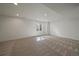 Spacious basement with neutral carpet and recessed lighting at 5586 S Harlan St, Littleton, CO 80123