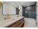 Lavish bathroom with double vanity, tub, and modern lighting at 5586 S Harlan St, Littleton, CO 80123