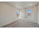 Bright bedroom with two windows, neutral carpet, and plenty of space at 5586 S Harlan St, Littleton, CO 80123