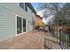 Large wooden deck with metal railing and outdoor seating at 5586 S Harlan St, Littleton, CO 80123