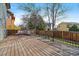 Open deck with modern outdoor furniture and beautiful backyard at 5586 S Harlan St, Littleton, CO 80123