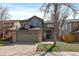 Charming two-story home with an attached two-car garage and well-maintained lawn at 5586 S Harlan St, Littleton, CO 80123
